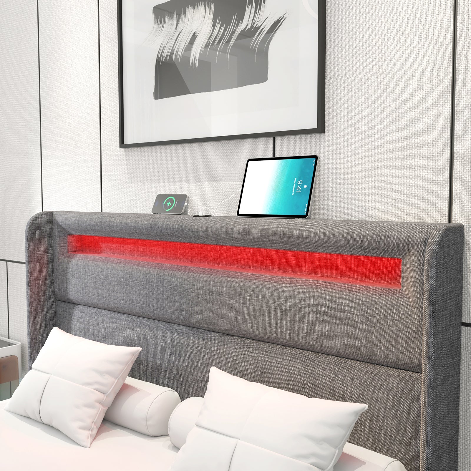 A close up view of the light grey wingback headboard and the integrated rgb are illuminated in red